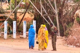 An army soldier talks to women on a street in Khartoum on June 6 2023 AFP photo