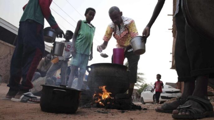 People prepare food in a Khartoum neighborhood Friday June 16 2023. AP photo