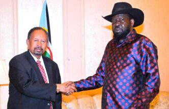 President Salva Kiir shakes hands with former Prime minister Abdallah Hamdok on December 8 2023 1