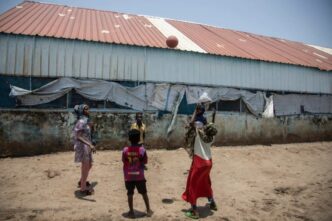 Children play with a ball in refugee camp in Sudan on August 15 2021 AFP photo