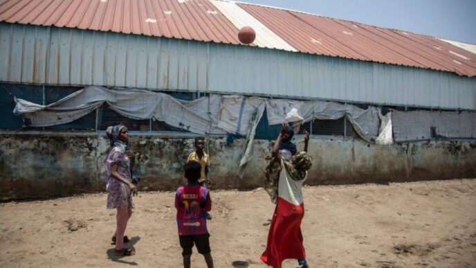 Children play with a ball in refugee camp in Sudan on August 15 2021 AFP photo
