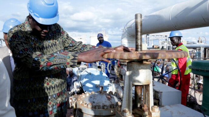 South Sudans Minister of Petroleum Ezekiel Lol Gatkuoth turns a spigot at an oil well at the Toma South oil field to Heglig in Ruweng State South Sudan on August 25 2018. Reuters