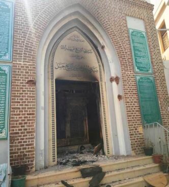 The damaged entrance of the site housing the grave of the late Sufi leader Sheikh Hassan Al Fatih Qaribullah at his mosque in Omdurmans Wad Nubawi neighbourhood