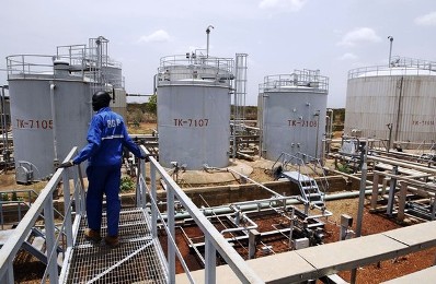 jpg a worker walks at the power plant of an oil processing facility at an oilfield in unity state april 22 2012 reuters